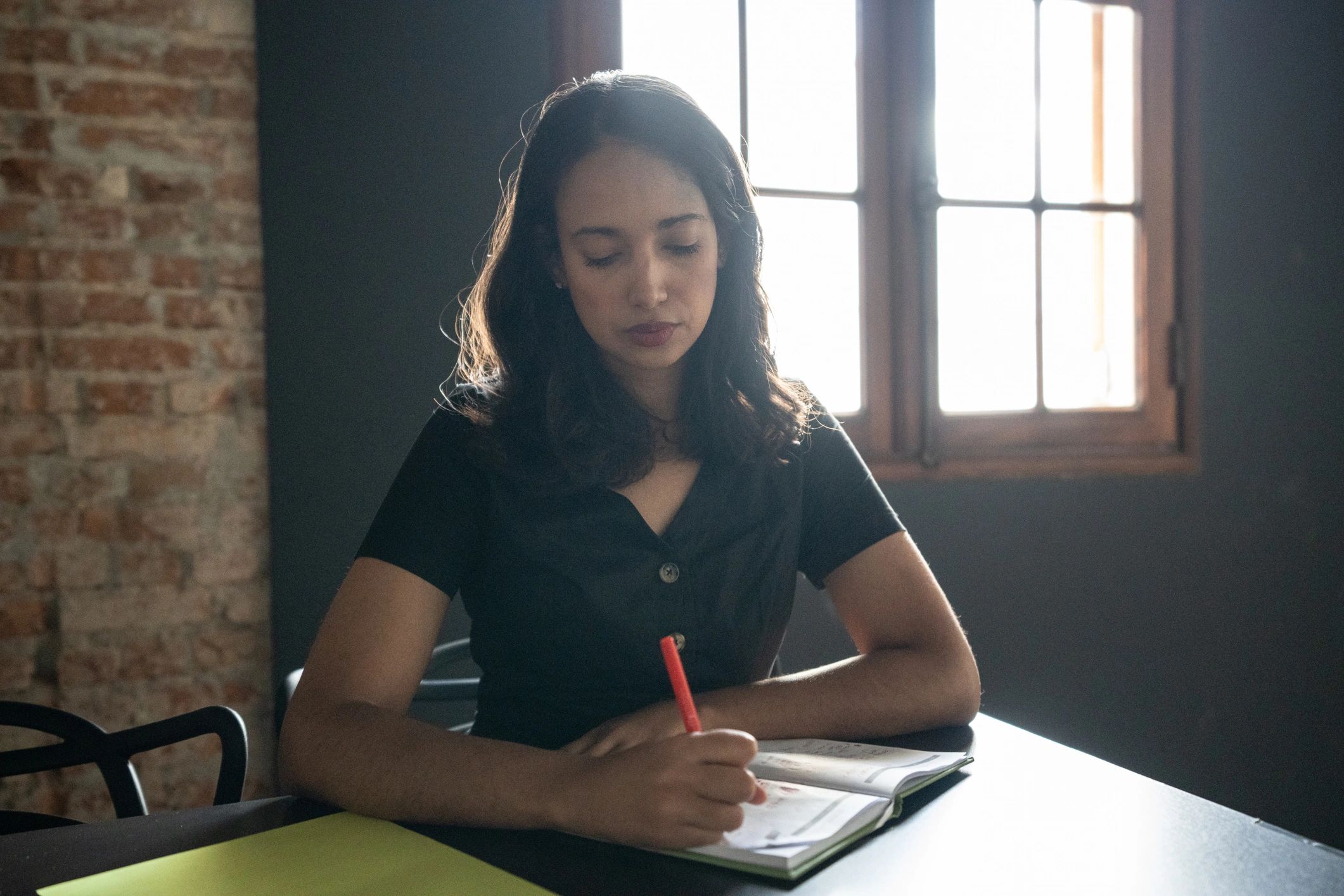 Writer taking notes during a seminar